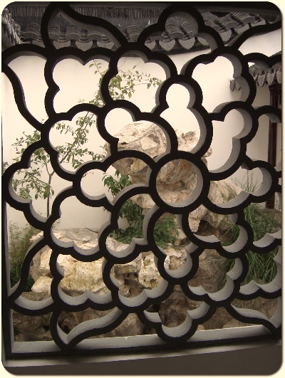 A Taihu rock sits behind the lattice window in the Dunedin Chinese Garden " Lan Yuan."  - yet what does it mean ?