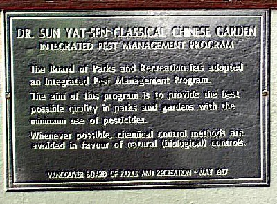 A merited sign, regarding an integrated pest management program adopted by the Dr. Sun Yat-Sen Classical Chinese Garden, in Vancouver, BC.