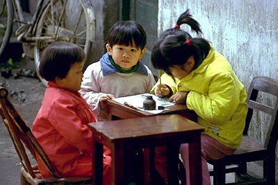 Chinese youth having fun with calligraphy or painting