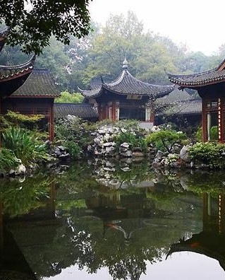 Vivid reflections in a Jade garden pond.
