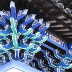 Blue woodwork detail on entrance paifang